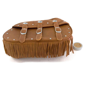 Tan leather motorcycle saddlebag with fringe detailing, three buckle straps, and silver studs.