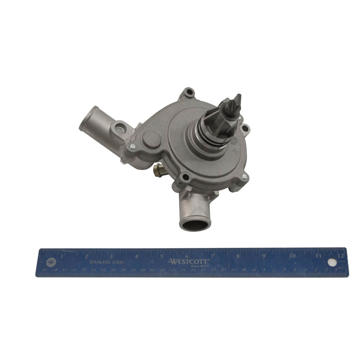 Gray metal water pump with multiple mounting points and cylindrical outlet, shown next to a blue 12-inch ruler for scale.