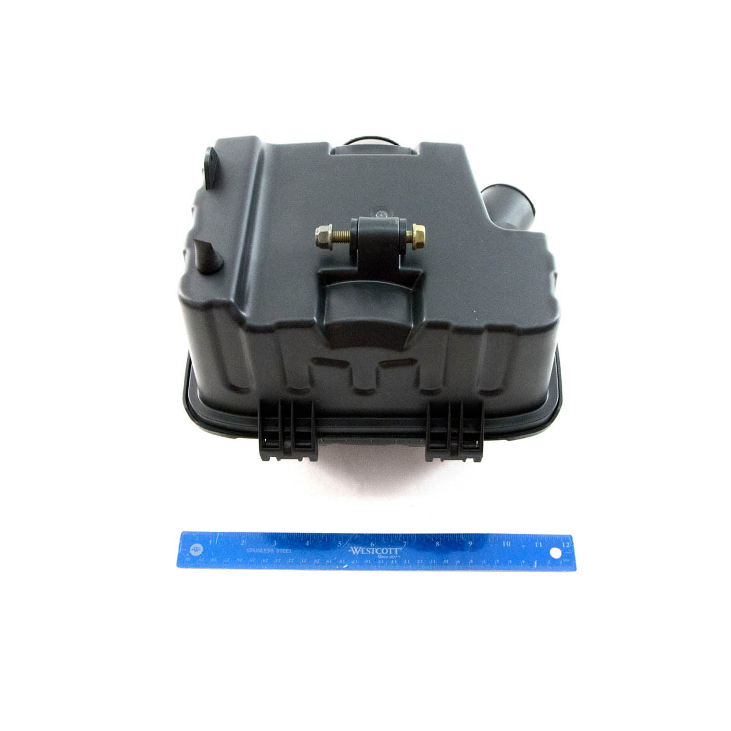 Black rectangular hard plastic airbox with secure clamps and mounting points, shown with a blue 12-inch ruler for scale.