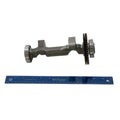 Metal balance shaft with gear teeth and splined end next to a blue 12-inch ruler.