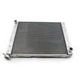 Rectangular black radiator core with silver metal frame and inlet/outlet tubes on white background.