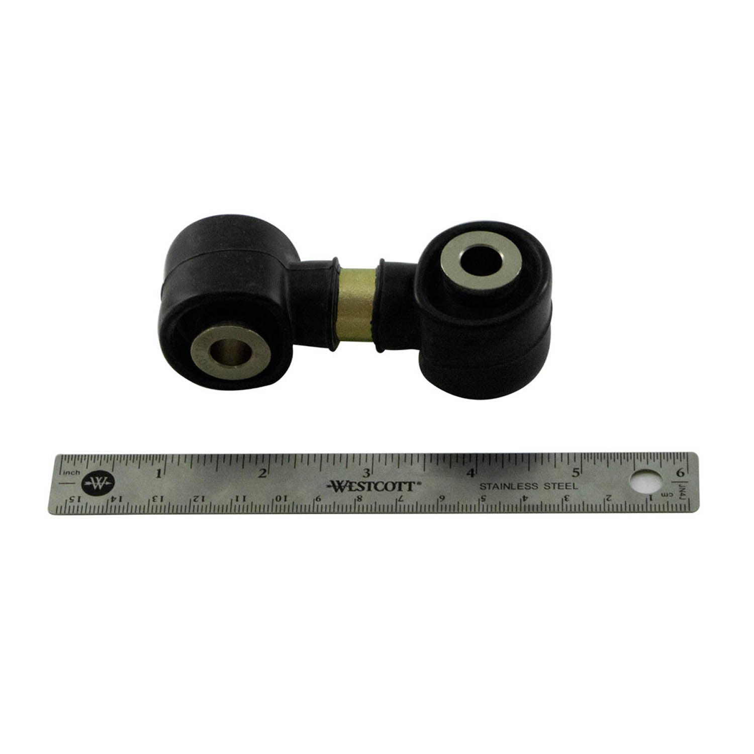 Black metal stabilizer bar linkage with rubber bushings on both ends next to a 12-inch metal ruler.