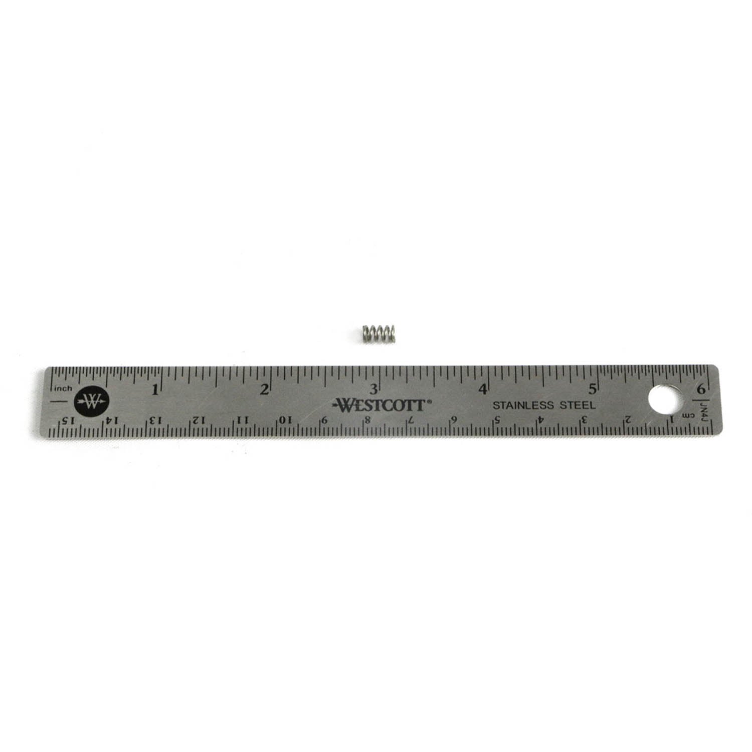 Silver metal ruler marked in inches and centimeters with small coiled spring on top.