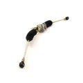 Metal Polaris steering gear box with black rubber boots and tie rod ends for offroad vehicles.