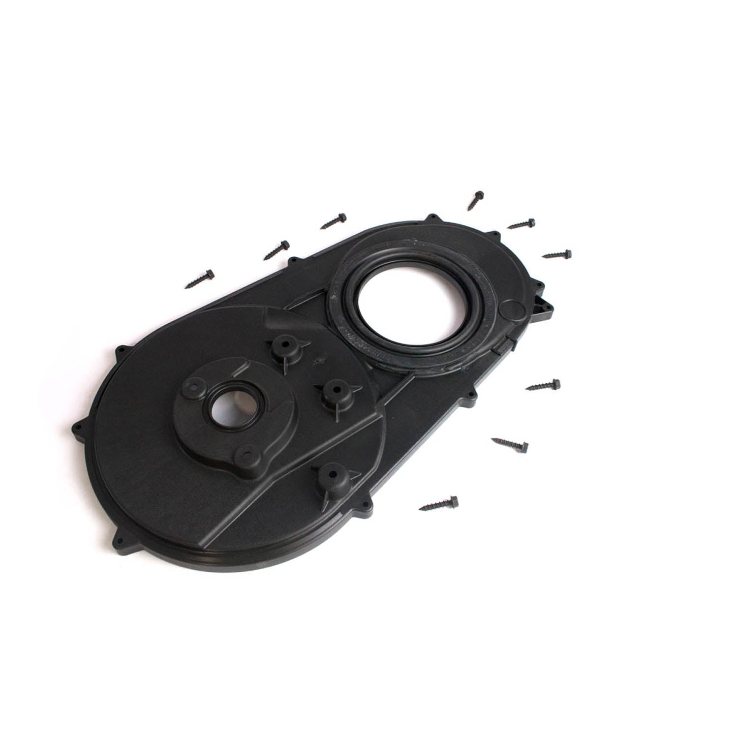 Black plastic inner clutch cover with circular openings and small screws scattered around.