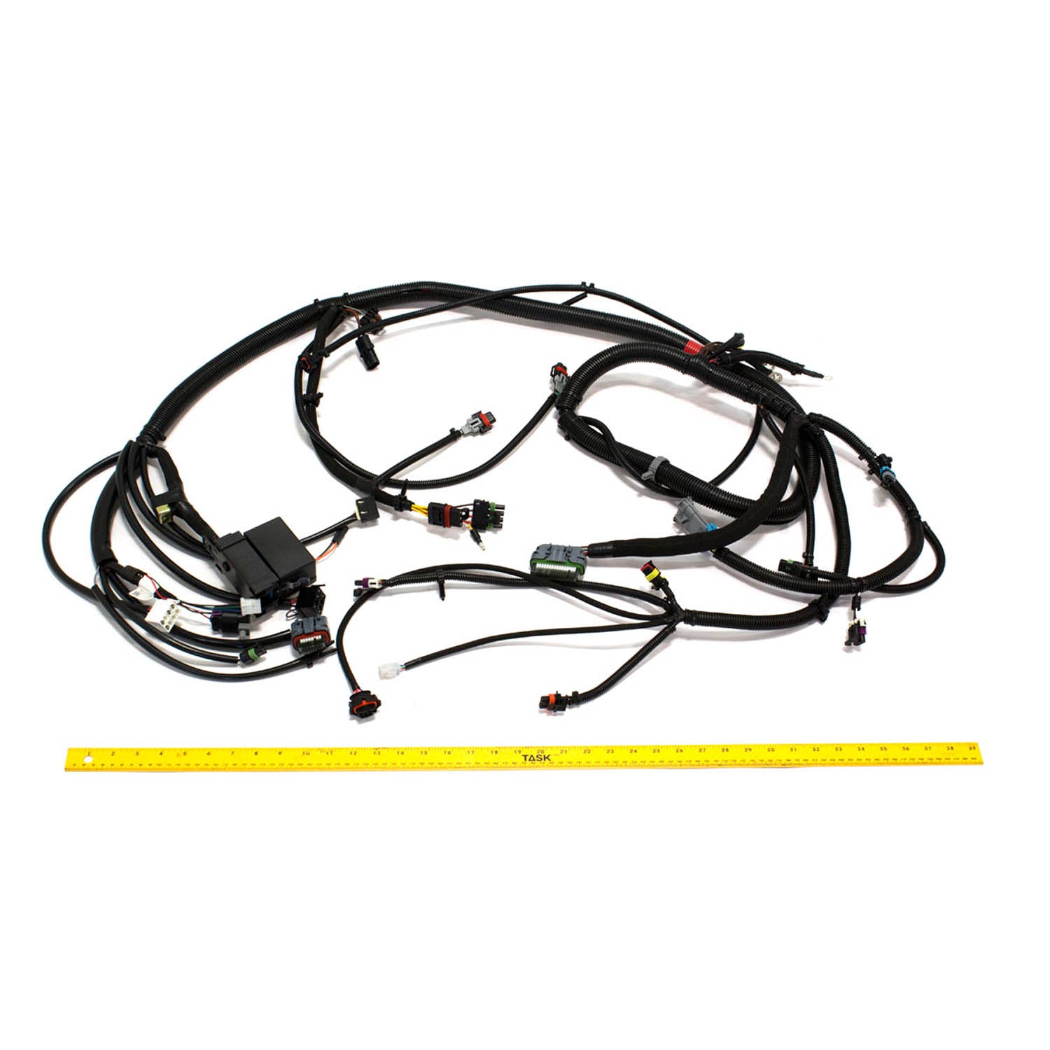 Black wiring harness with multiple connectors and protective sheathing for Polaris EFI regulator, laid flat with yellow.