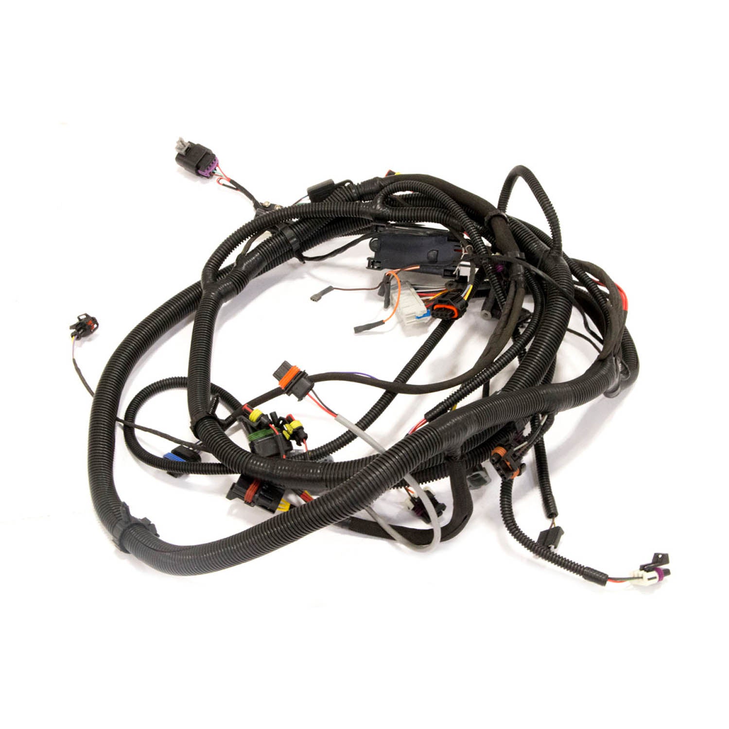 Black complex wiring harness with multiple connectors and protective tubing for Polaris 4x4 UTV chassis.