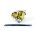 Polaris halogen headlight housing with gold reflector and clear lens, shown with ruler for scale.