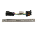 Right LED headlight harness with black plastic connectors and yellow, green, and black wires, next to a 6-inch metal ruler.