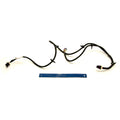 Black wired cargo box harness with connectors and clips, laid flat next to a blue ruler for scale.