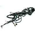 Black wiring harness with multiple connectors and bundled cables for Polaris UTV chassis.
