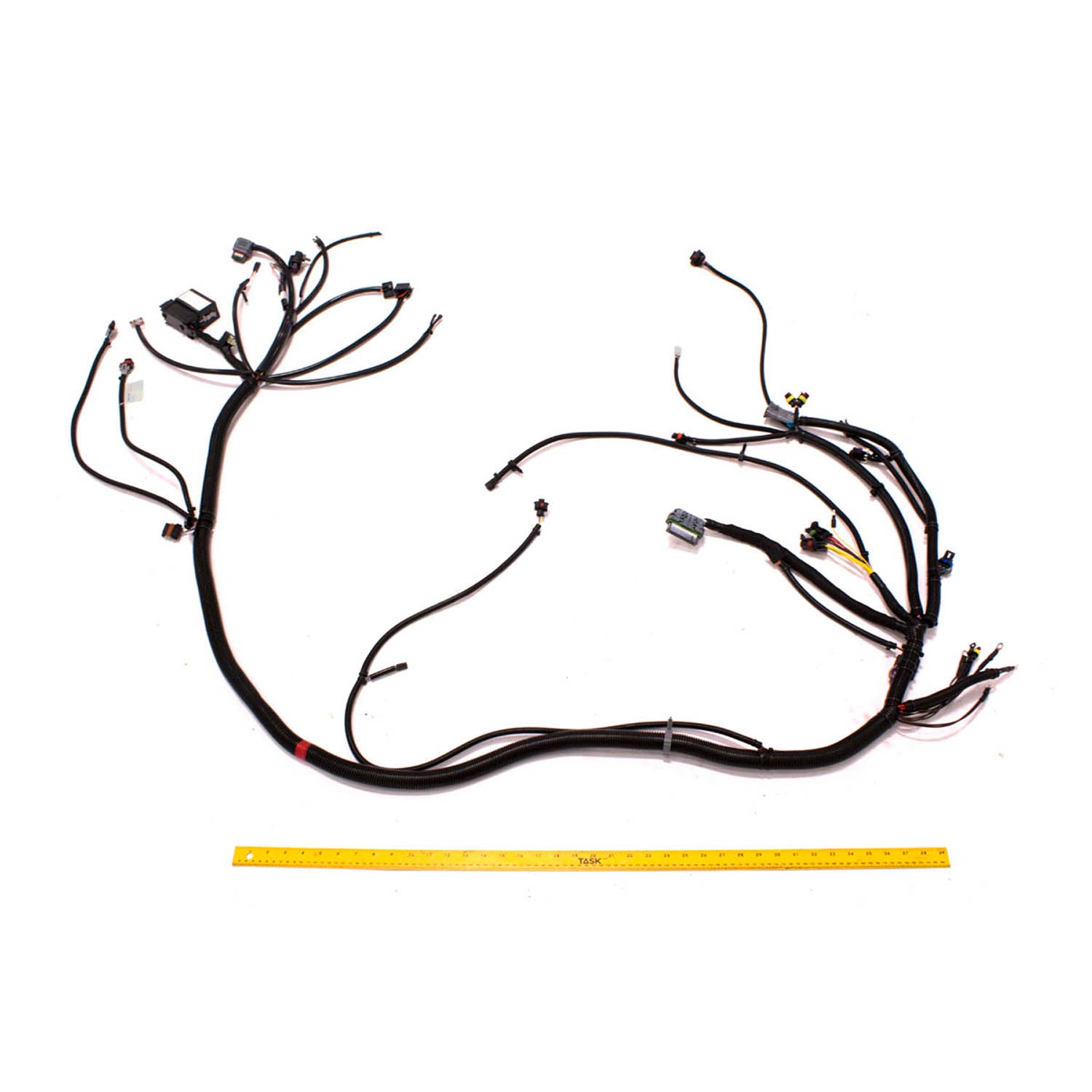 Black insulated wiring harness with multiple connectors and terminals designed for off-road vehicle use against white.
