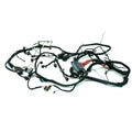 Black insulated wiring harness with multiple connectors and protective sleeves for offroad vehicle chassis.
