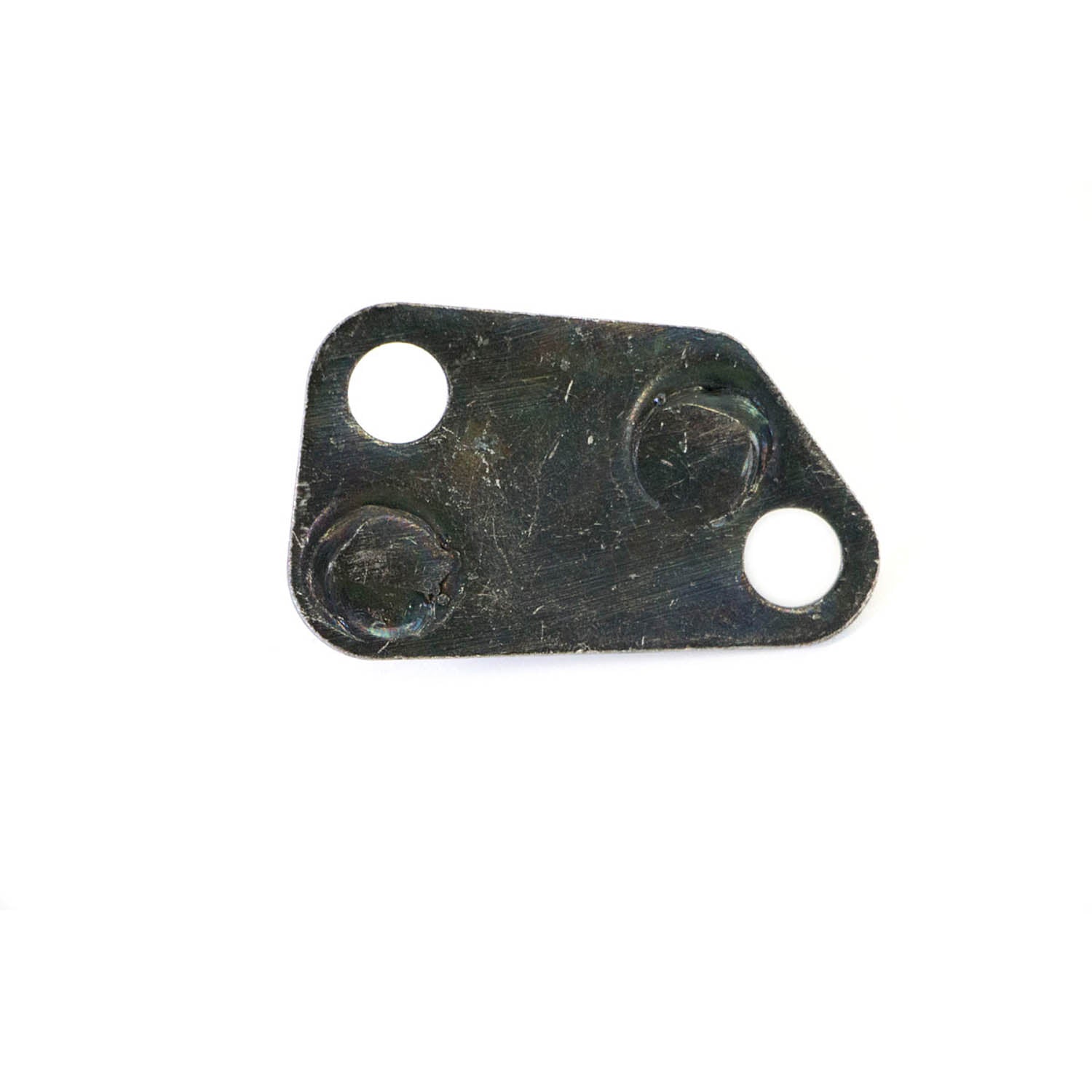 Black irregular triangular metal plate with three circular holes, two larger and one smaller, featuring slight surface wear.