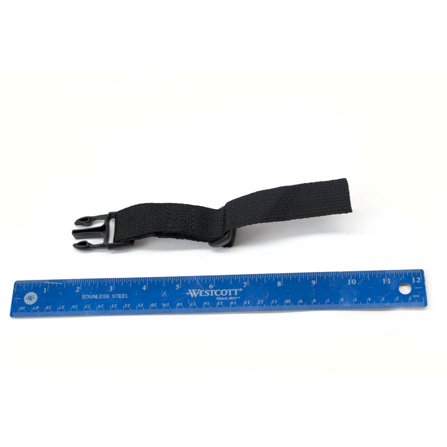 Black nylon latch strap with plastic buckle, next to a blue 12-inch ruler for scale.