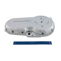 Polished chrome motorcycle primary cover with smooth rounded edges and multiple bolt holes, displayed next to a blue ruler.