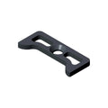 Black rectangular retainer cam follower with central circular hole and elongated slots on each side.