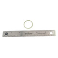 Small beige rubber O-ring next to a stainless steel ruler showing about 1 inch diameter.