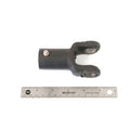 Black metal prop shaft yoke with forked end and machined holes, shown next to 6-inch ruler for scale.