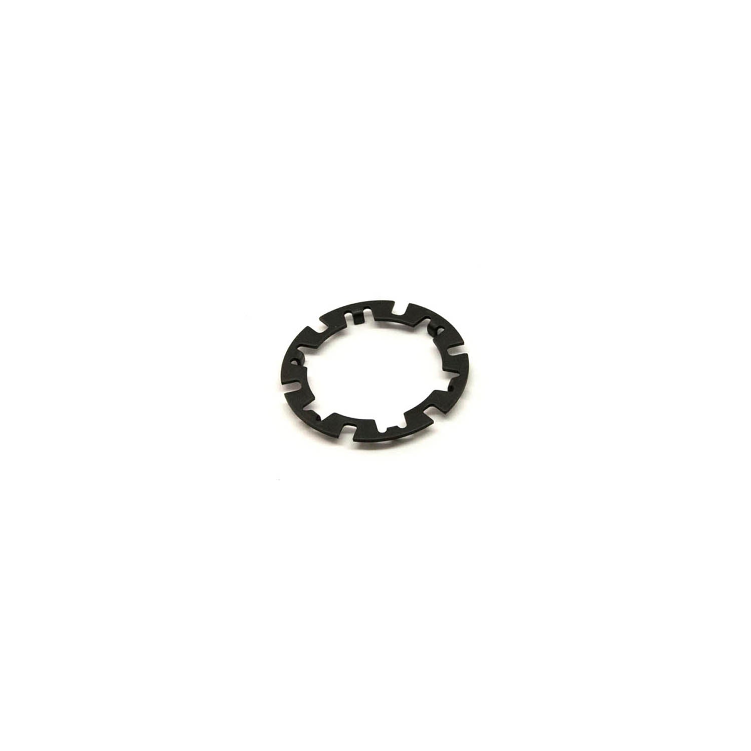 Black metal armature plate with evenly spaced notches around circular edge.