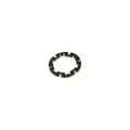 Black metal armature plate with evenly spaced notches around circular edge.