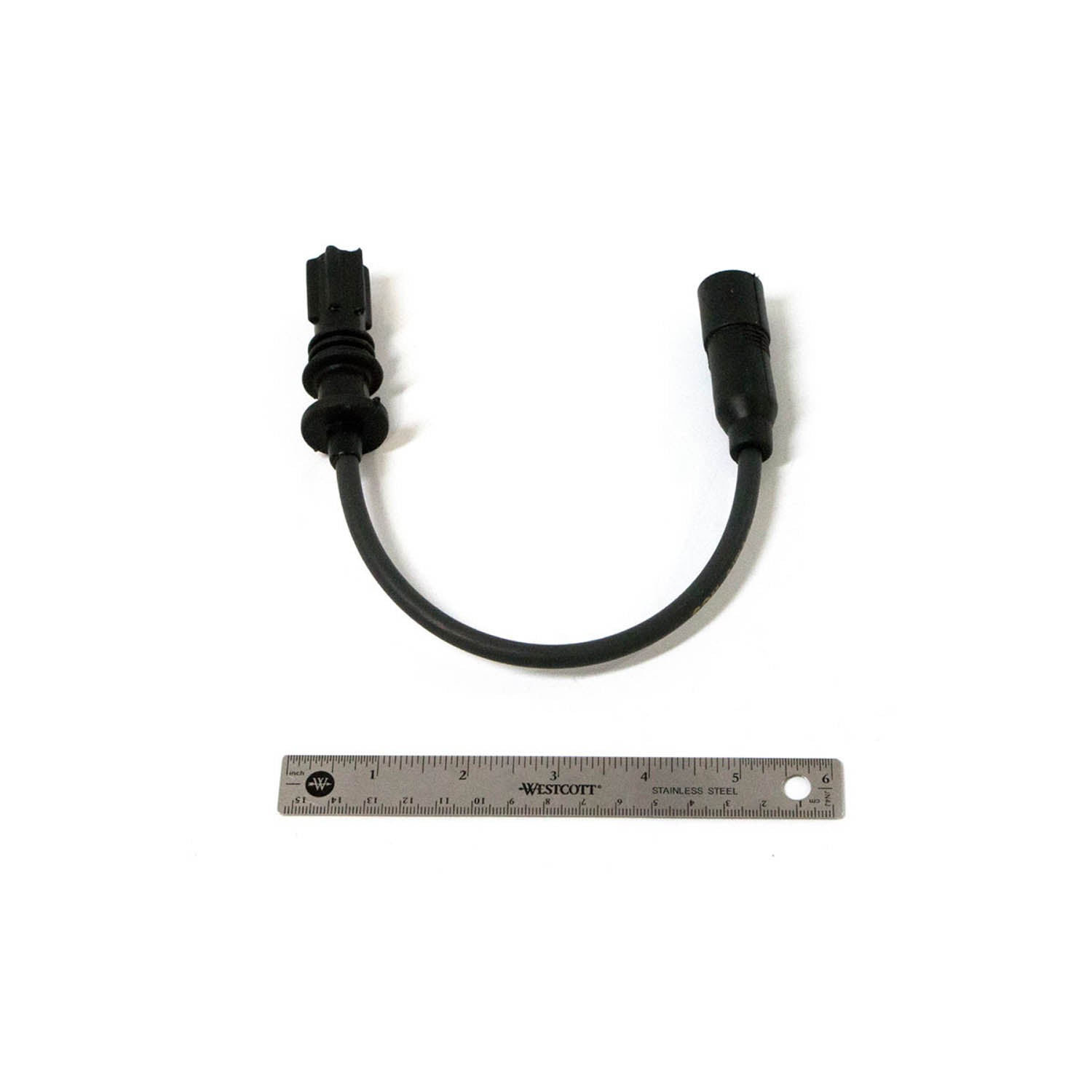 Black spark plug wire with rubber connectors on both ends, approximately 8 inches long, flexible cable designed for Polaris.