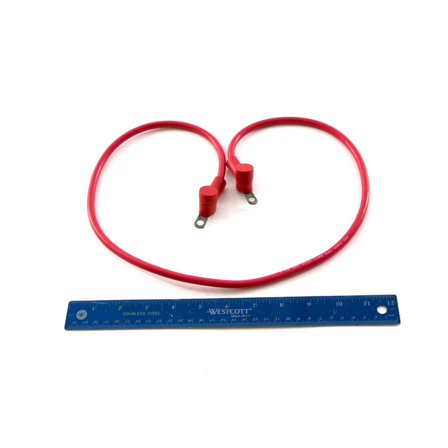 Red start to solenoid cable with metal ring terminals and protective red insulation, alongside a blue 12-inch ruler for size
