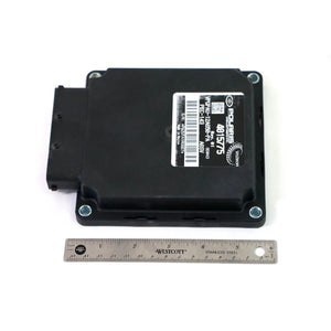 Black rectangular motorcycle PCM unit with mounting holes and barcode label, placed next to a six-inch ruler for scale.
