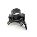 Black metal steering knuckle with circular bearing housing and three mounting points.