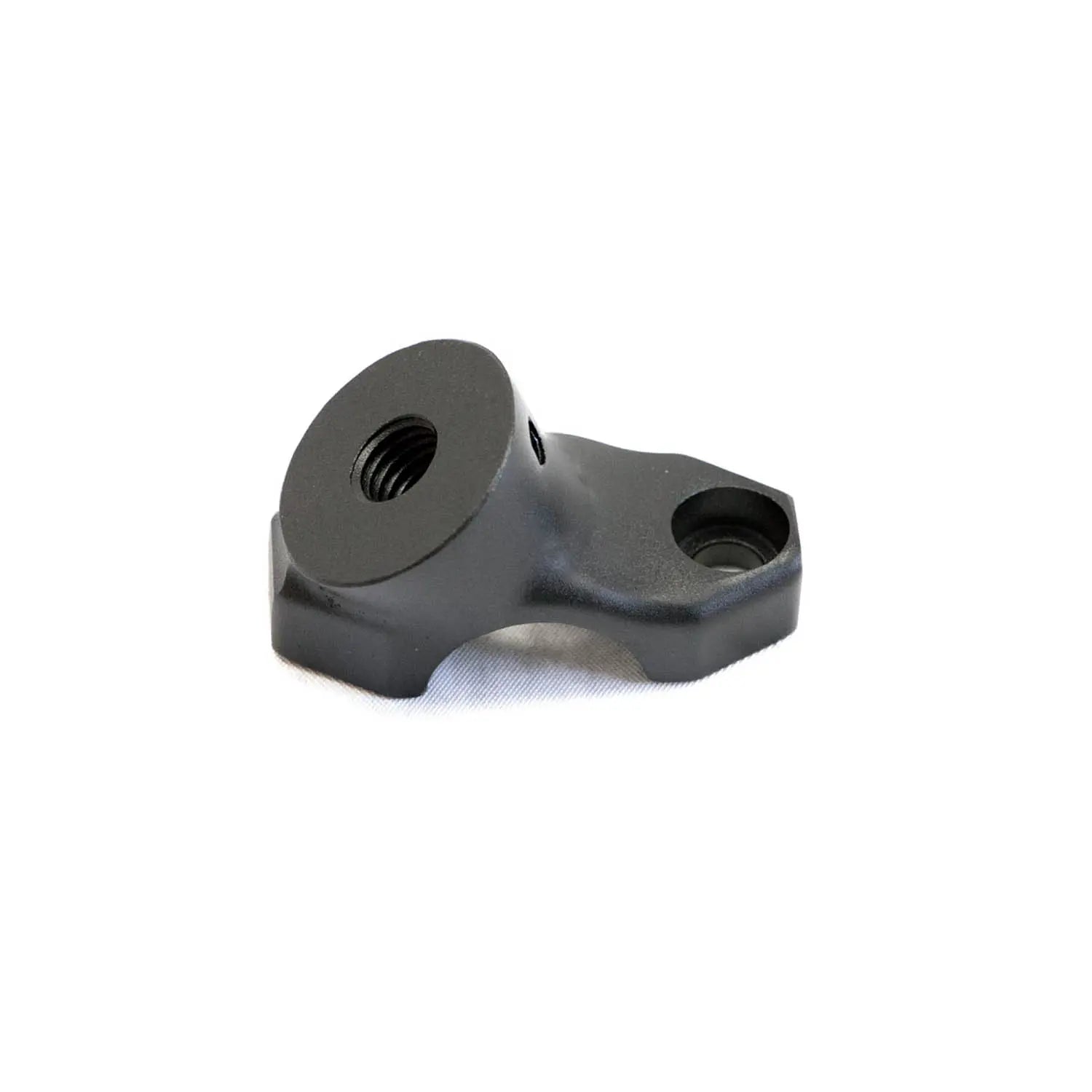 Black metal fairing bottom riser with threaded hole and mounting point, compact design.