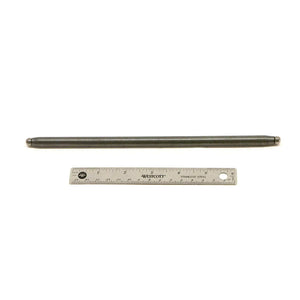 Long slender metallic pushrod with polished finish next to a steel ruler for scale.