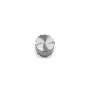 Round metallic valve tappet with a smooth, reflective surface and a polished finish.
