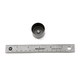 Metal valve tappet with central hole, next to 6-inch stainless steel ruler on white background.