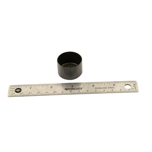 Black cylindrical metal valve tappet next to a 6-inch stainless steel ruler.