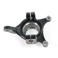 Black metal front steering knuckle with round central bearing housing and three mounting points.