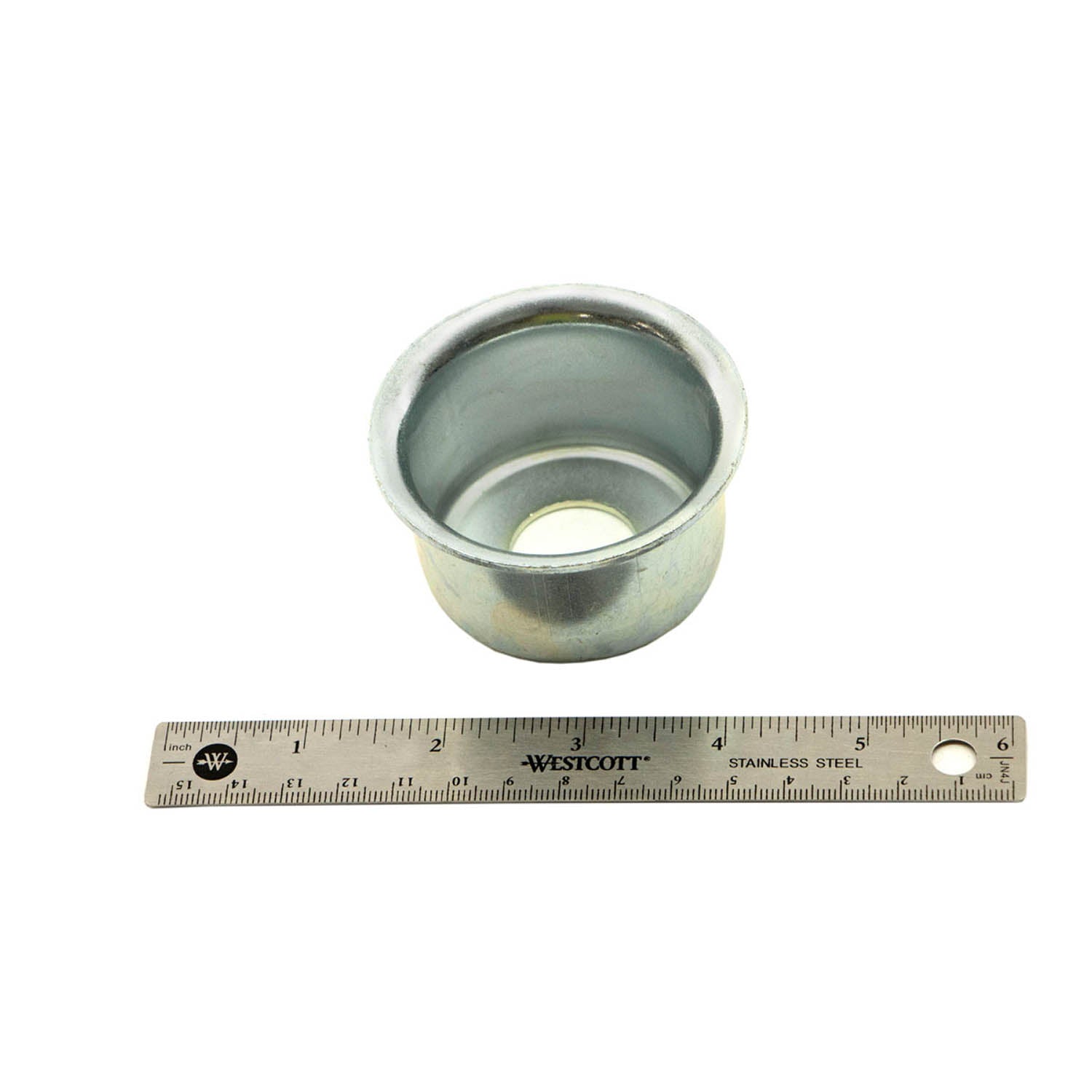 Metal cup spring boss with circular flanged top and hollow center, shown next to a 12-inch ruler for scale.