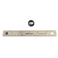 Small black rubber inlet oil seal with circular shape, next to a 12-inch stainless steel ruler for scale.