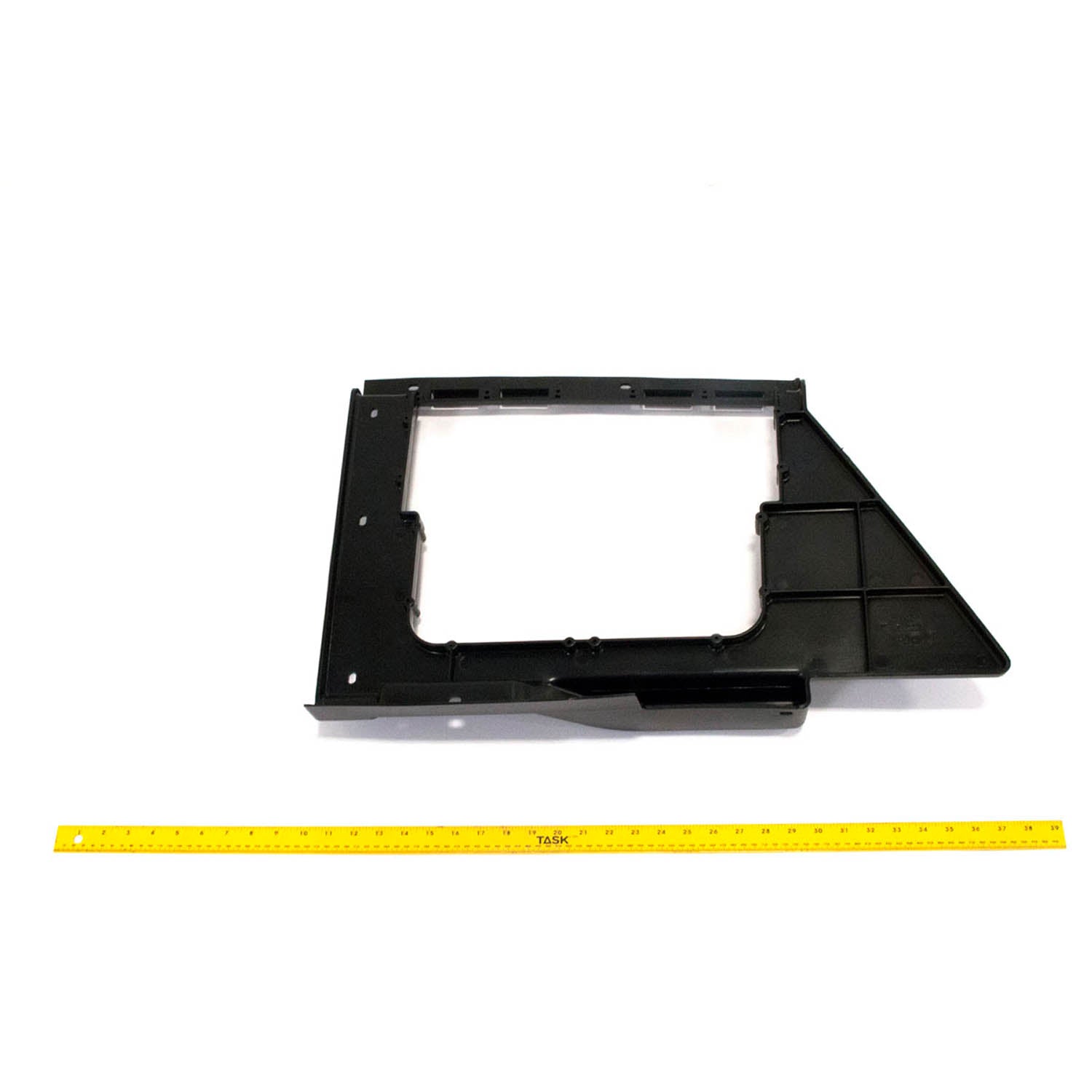 Gloss black rectangular plastic fender storage box with angular cutout and grid pattern panel.