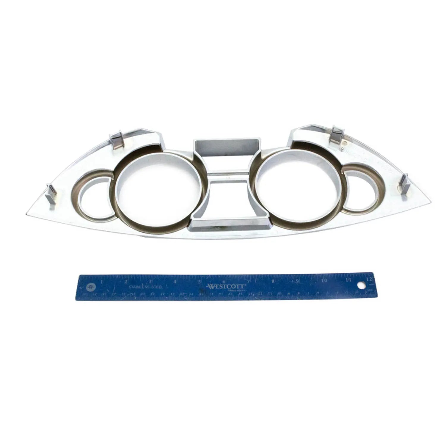 Chrome gauge bezel with dual circular openings and angular metal frame for Victory Vision motorcycles, shown with blue ruler