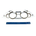 Chrome gauge bezel with dual circular openings and angular metal frame for Victory Vision motorcycles, shown with blue ruler