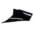 Glossy black angular motorcycle body side cover with smooth surface and sharp edges.