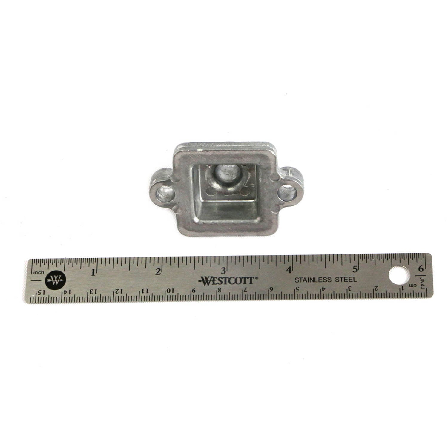 Silver die-cast metal case cover breather with rectangular shape and mounting holes, next to 6-inch ruler.