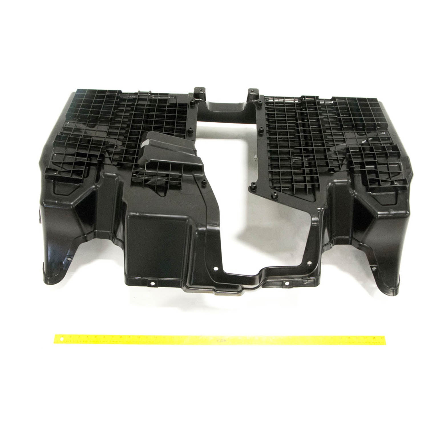 Gloss black molded plastic lower floor panel with textured grip areas and mounting points for Polaris UTV models.
