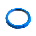 Round blue plastic bezel with textured grip sections for instrument cluster mounting.