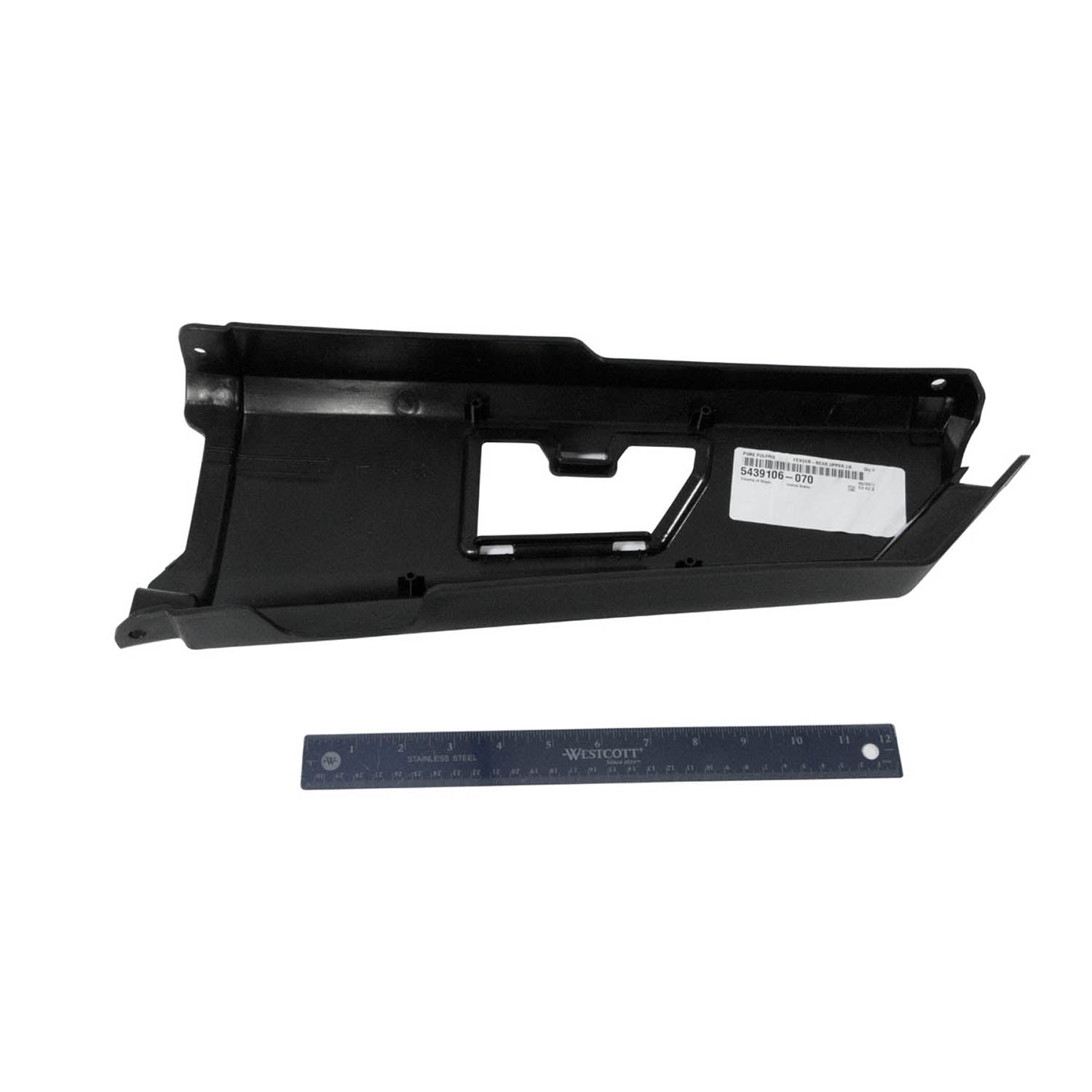 Black plastic rear upper fender panel for Polaris UTV with mounting holes and angled edges, shown with ruler for scale.