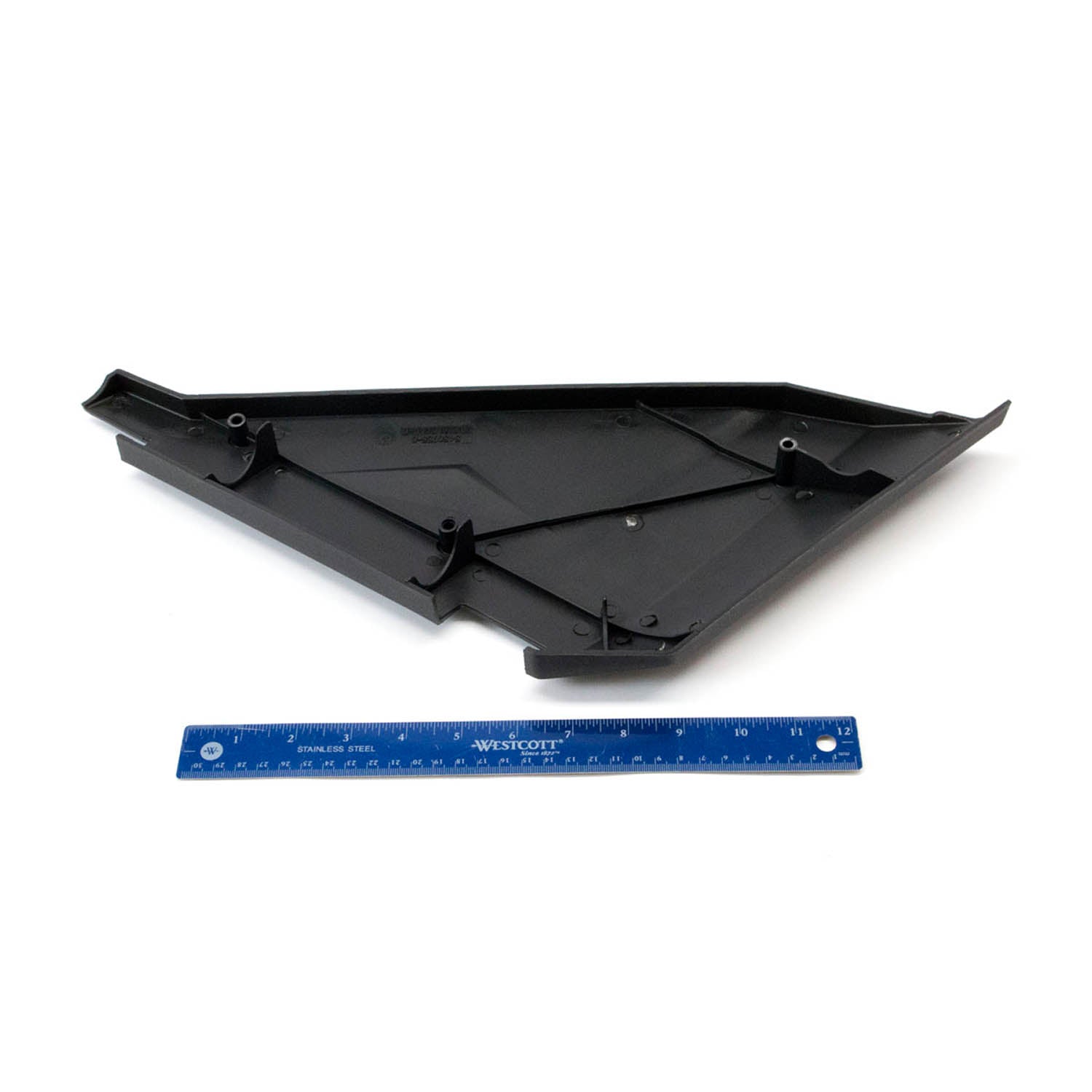 Black triangular plastic bolster cover panel with mounting tabs alongside a blue 12-inch ruler.