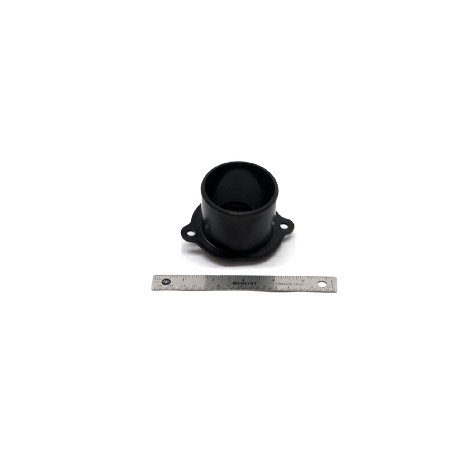 Black cylindrical plastic intake boot with mounting flanges and holes, shown next to a metal ruler.