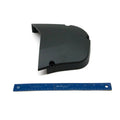 Black curved outer sprocket cover with smooth matte finish and mounting holes, shown next to a blue 12-inch ruler for scale.