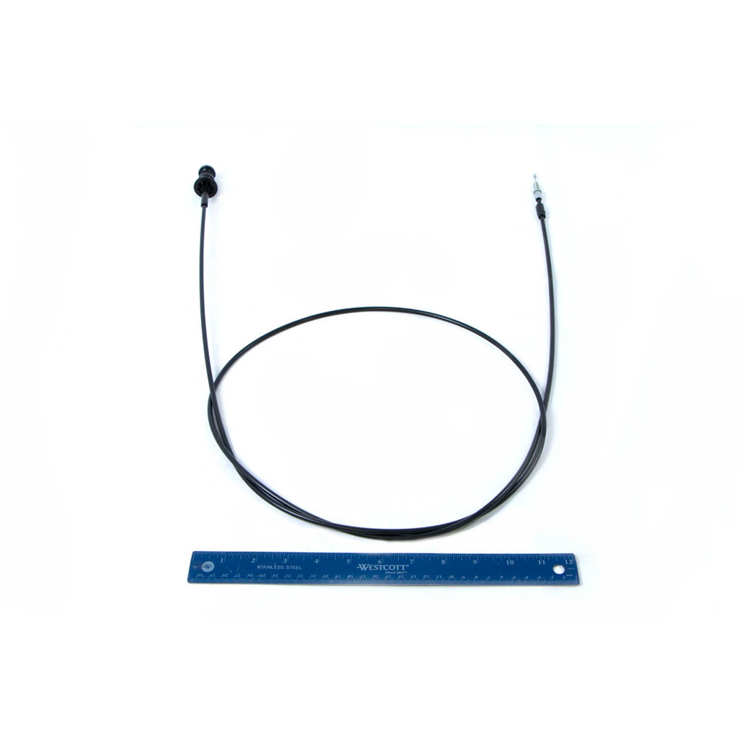 Black flexible choke cable with metal connectors at both ends, shown next to a blue ruler for scale.