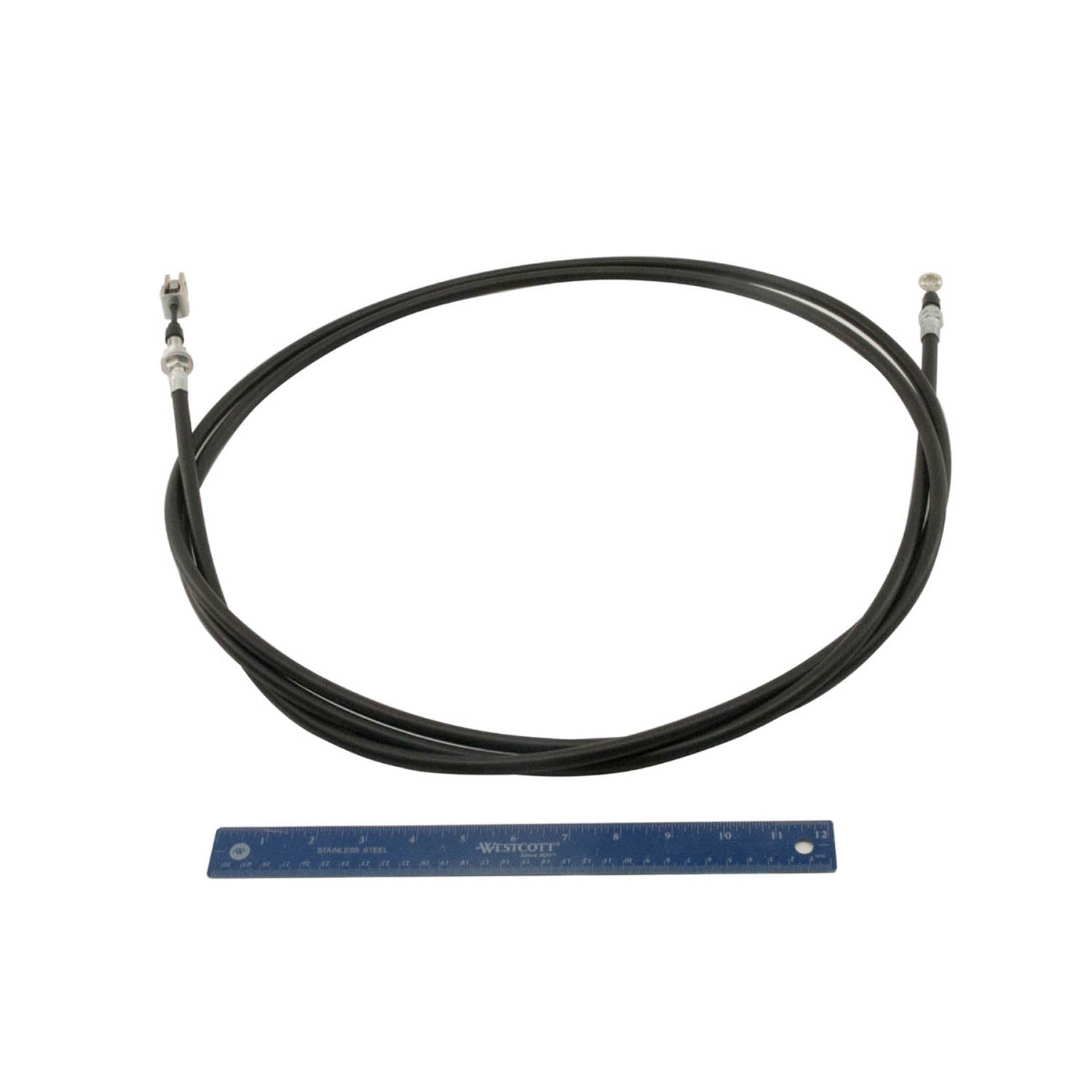 Black coiled parking brake cable with metal fittings on both ends, shown with a blue ruler for scale.